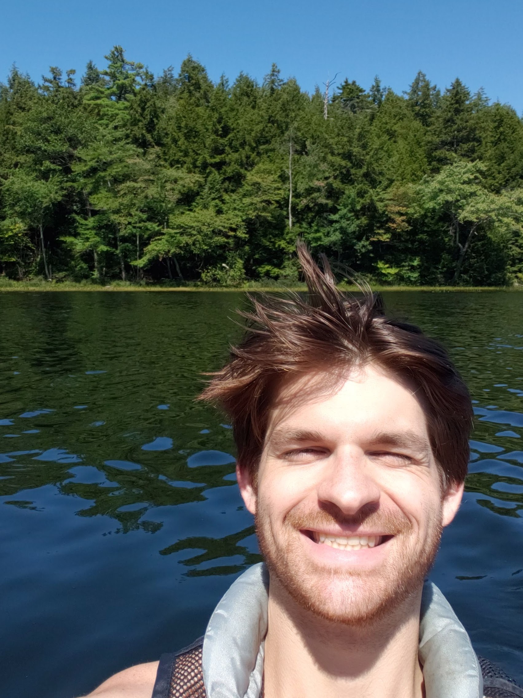 Selfie of Michael kayaking in the Adirondacks circa 2023.